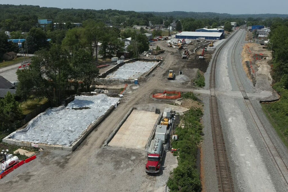 Aerial view of two railroad tracks and soil removal work
