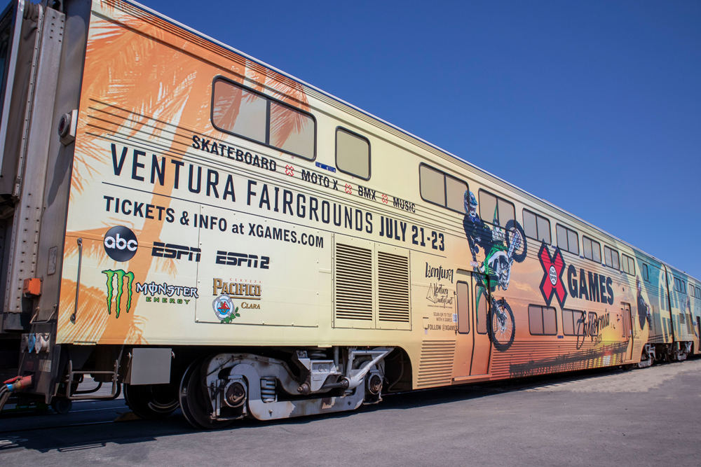 Bilevel passenger car wrapped with advertising for X Games sporting event