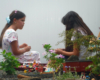 two girls sitting in garden railway