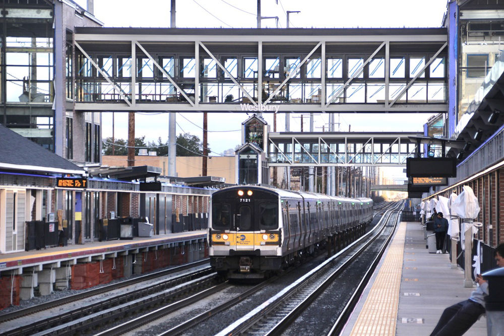Electric multiple-unit commuter train passes through station