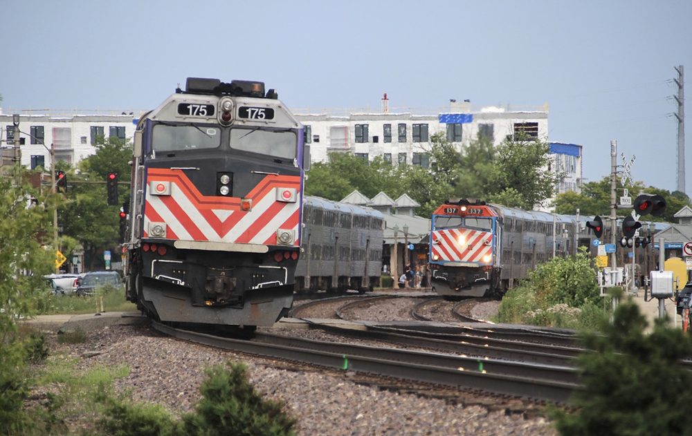 Two commuter trains meet on curve