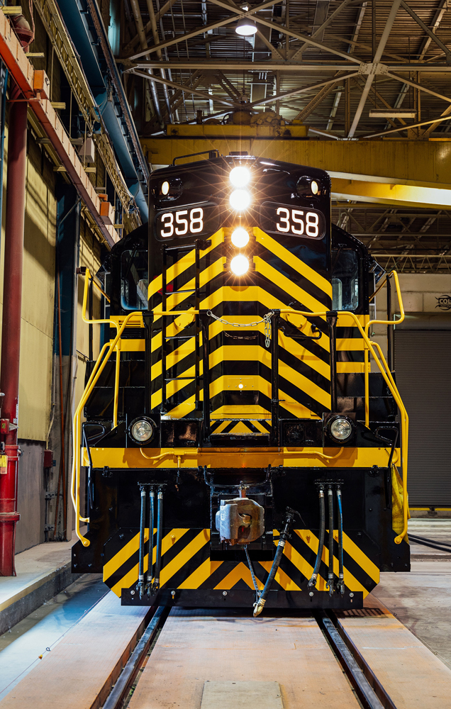 Front view of black and gold locomotive