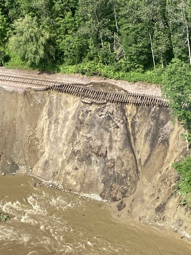 Aerial view of landslide under railroad tracks