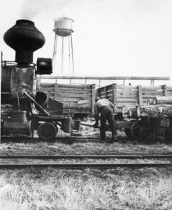 Man hooking together to rail cars