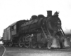 Man oiling Georgia Railroad steam locomotives