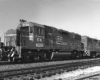 New Georgia Railroad diesel locomotives on freight train in yard