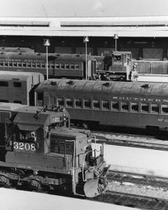Diesel locomotives and passenger cars on passenger station tracks