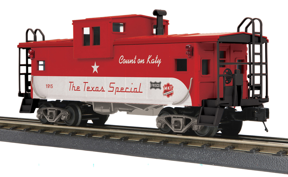 Photo of O gauge wide-cupola caboose in red and silver paint.