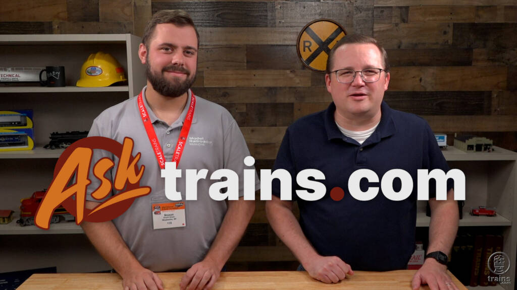 Ask Trains.com August 2023 compilation: Two men in polo shirts standing behind a table