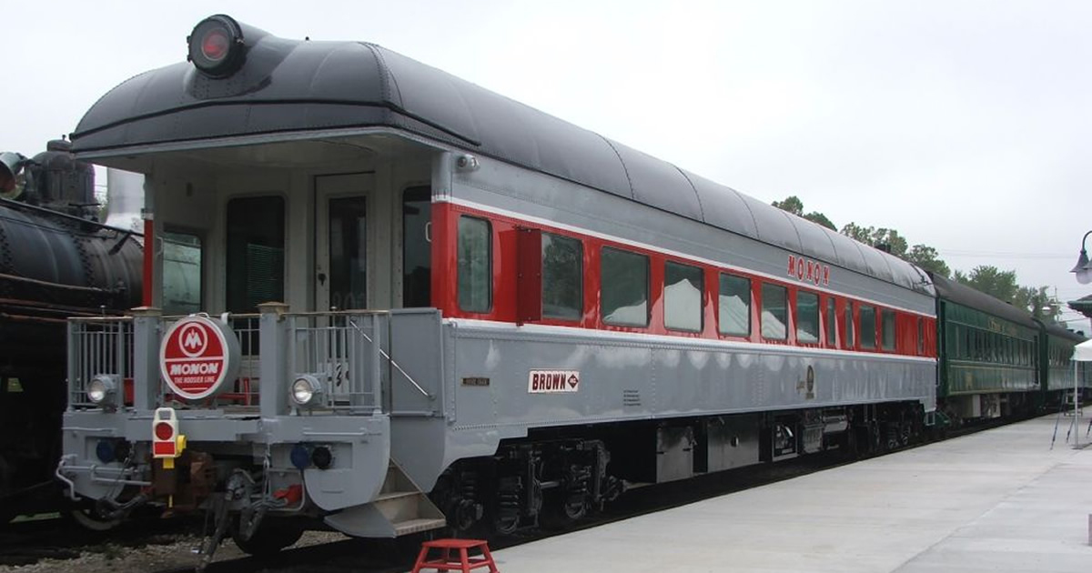 Gray and red passenger car with end platform