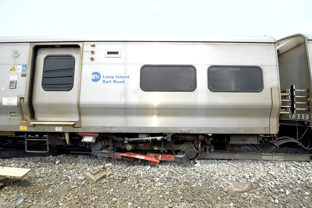Side view of derailed car on LIRR train