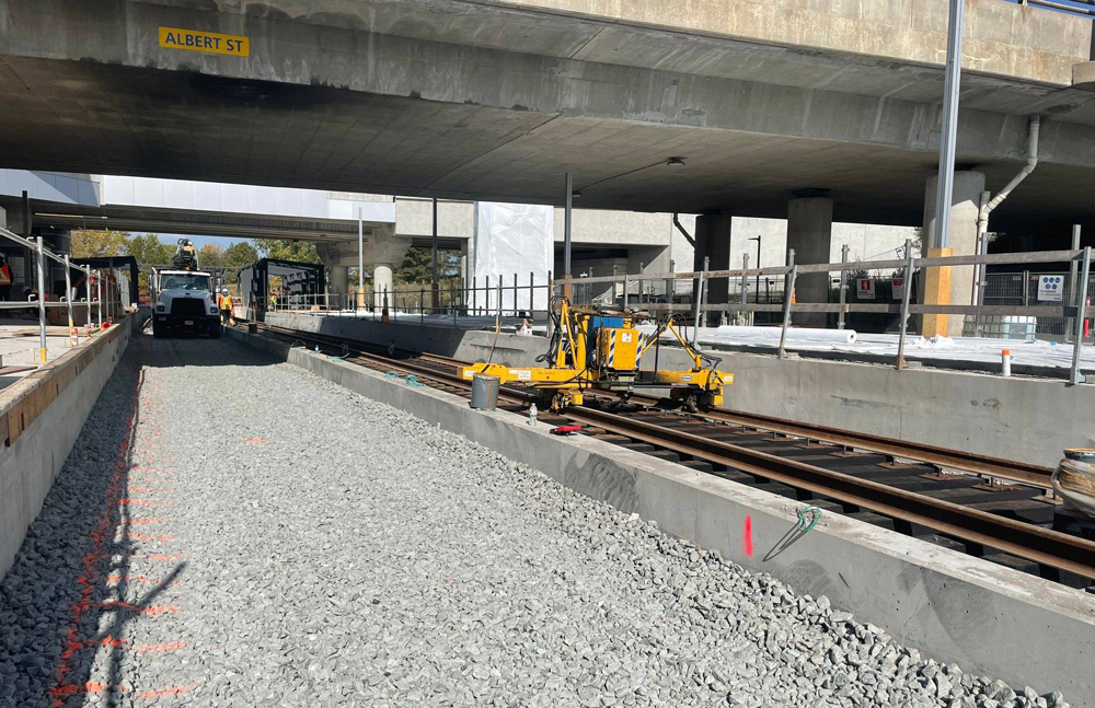 Construction on light rail line below roadway bridge