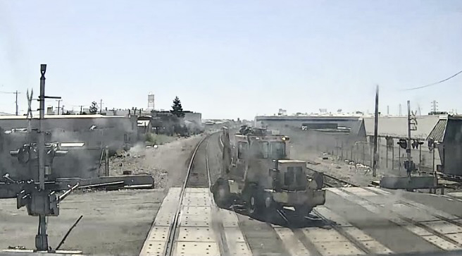 Image of tractor-type machine on railroad tracks