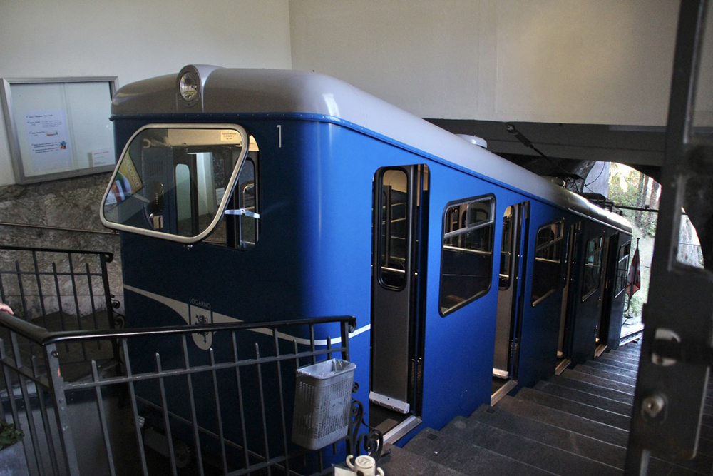 Blue funicular car in building