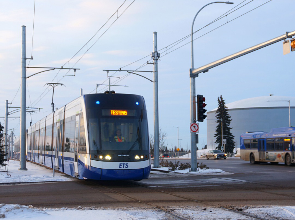 Light rail train at grade crossing