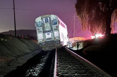 Derailed passenger car illuminated by floodlights