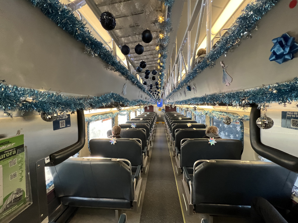 Interior of gallery car with tinsel and other decorations