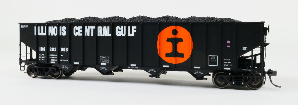 Color photo of HO scale four-bay hopper painted black with orange herald and white graphics.
