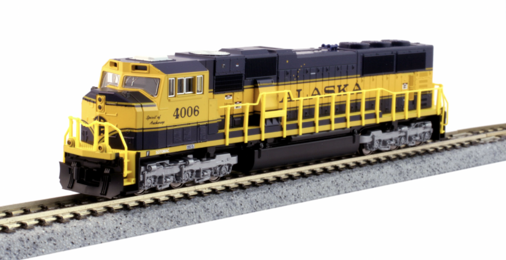A model locomotive in a blue and yellow paint scheme