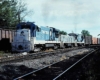 Blue-and-white diesel Rock Island locomotives on freight train