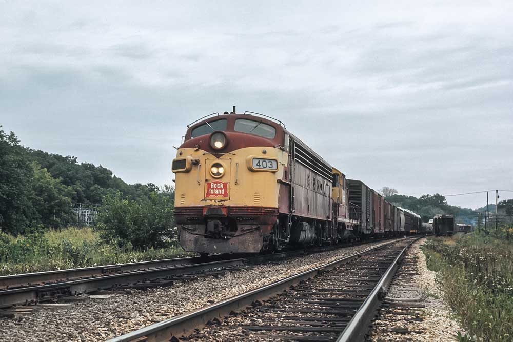 Maroon Rock Island locomotives on freight train