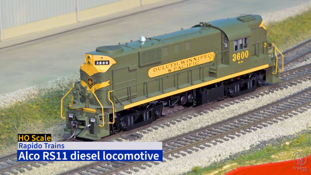 Title screen of video showing HO scale locomotive painted green and yellow.