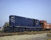 Blue-and-white diesel Chicago & Eastern Illinois locomotives with red caboose