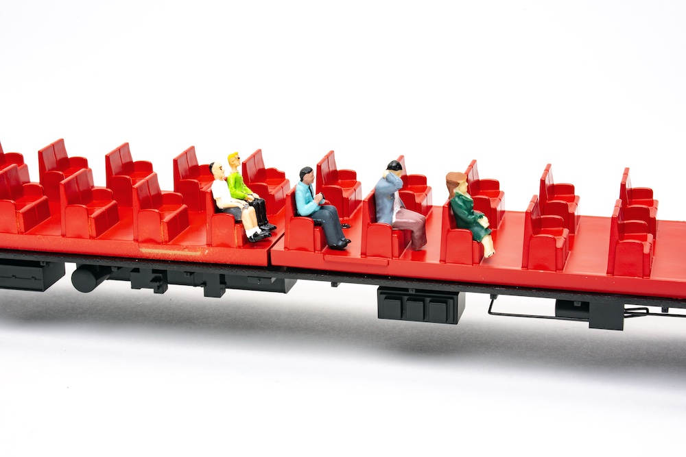 Seated figures glued onto plastic molded seats