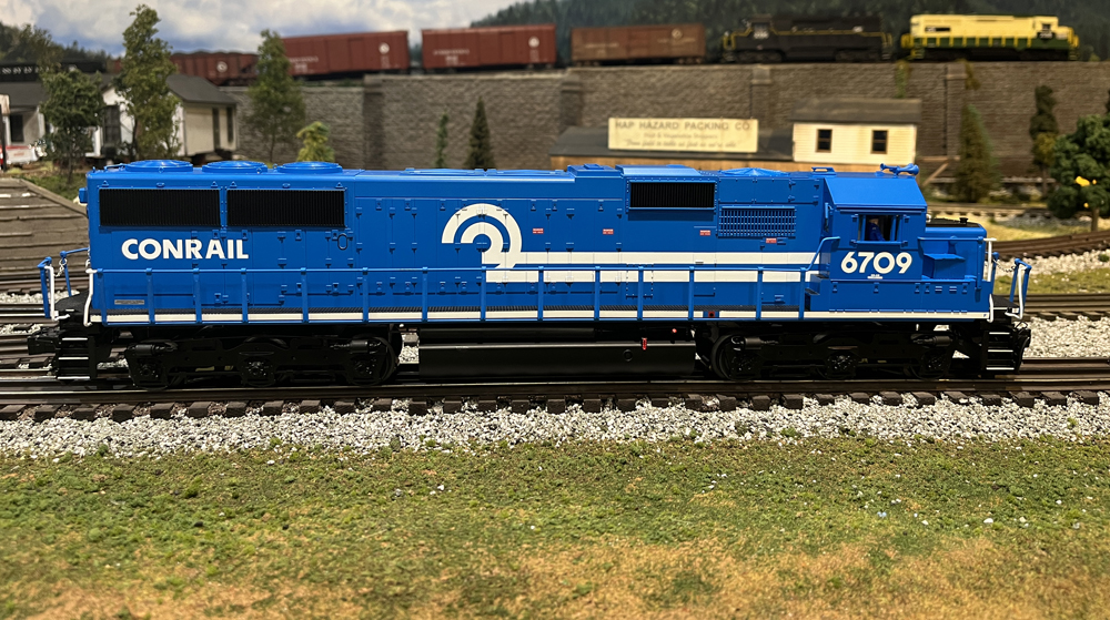 side view of blue model locomotive