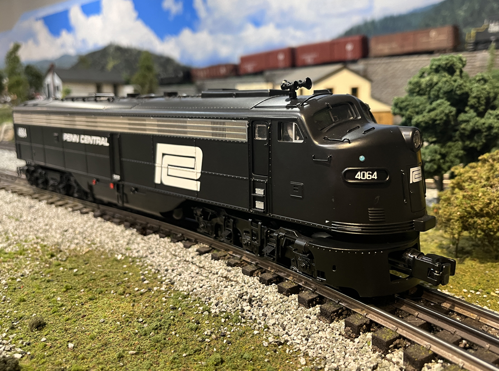 ¾ view of black model locomotive
