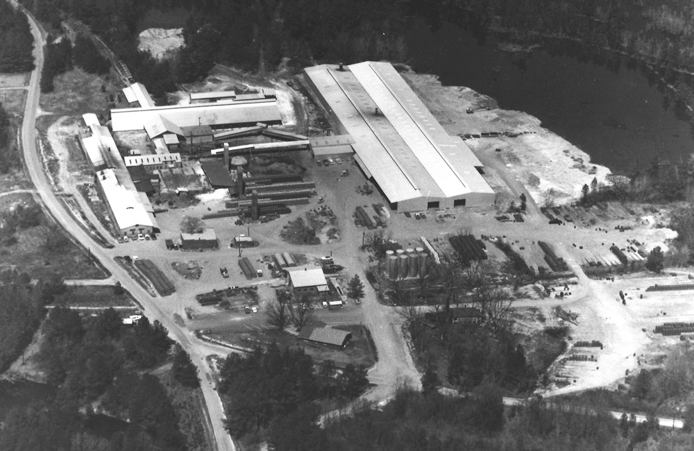A black-and-white aerial photo of a large brick works