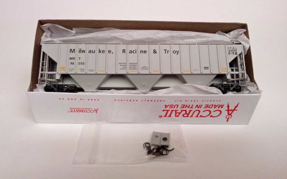 Color photo showing HO scale kit in box with parts in package in front.