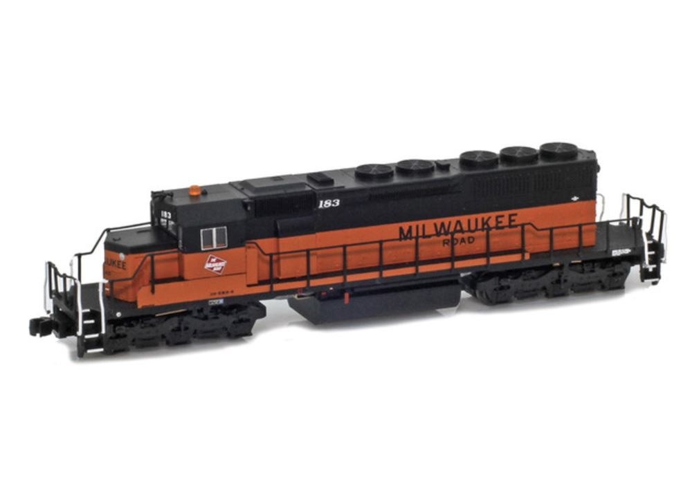 A model locomotive in a black and orange paint scheme