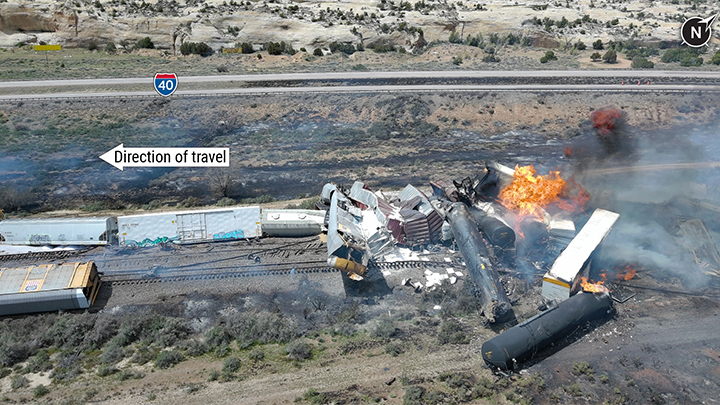 Aerial view of derailment with burning tank cars
