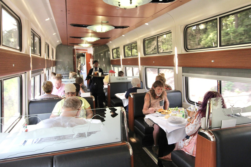 Passengers eating in dining car