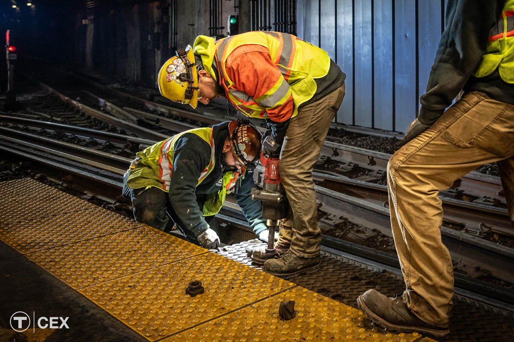 Maintenance workers at station platform