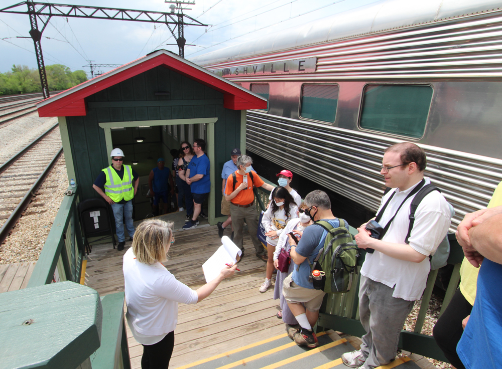 People lined up outside passenger car