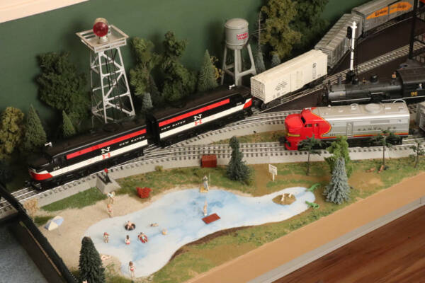 scene on model train layout with swimming pool