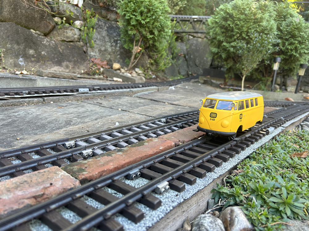 yellow vehicle on track: Replacing roadbed