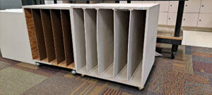 Gray wooden carts with vertical dividers