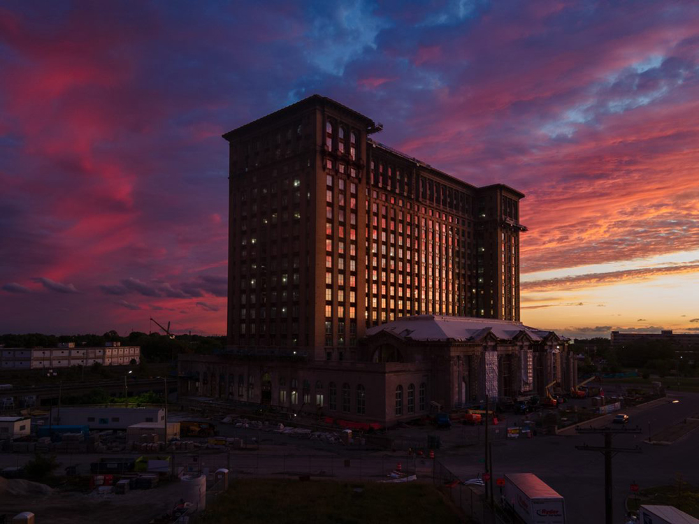 13-story building backlit by sunset