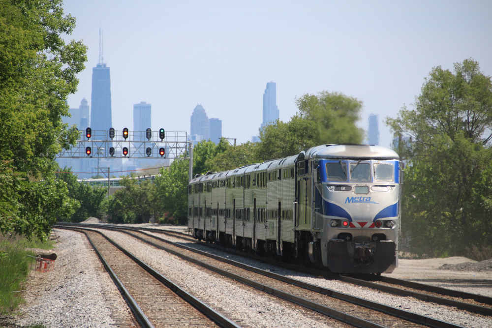 Commuter train with Chicago skyline in distance