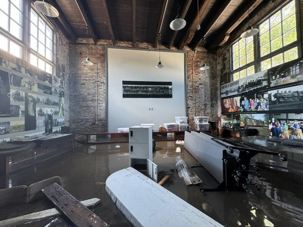 Flood water and debris inside brick building