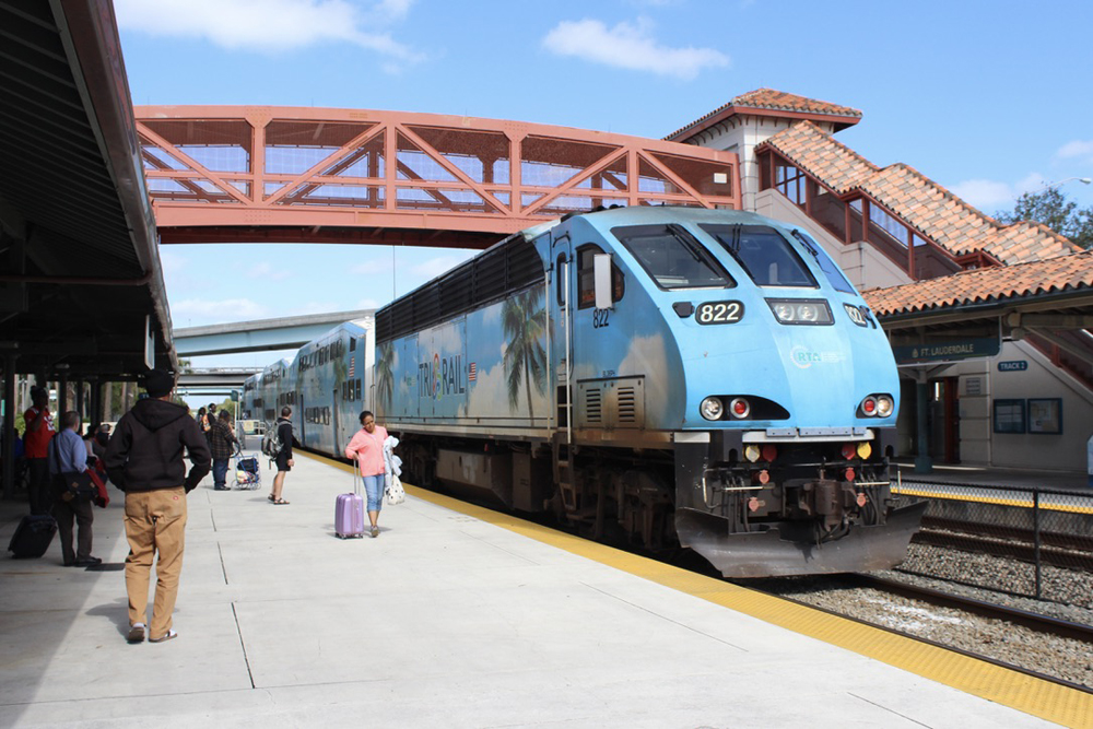 Blue locomotive at commuter rail station
