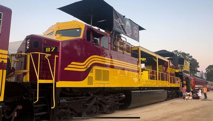 Modified locomotive in maroon and yellow