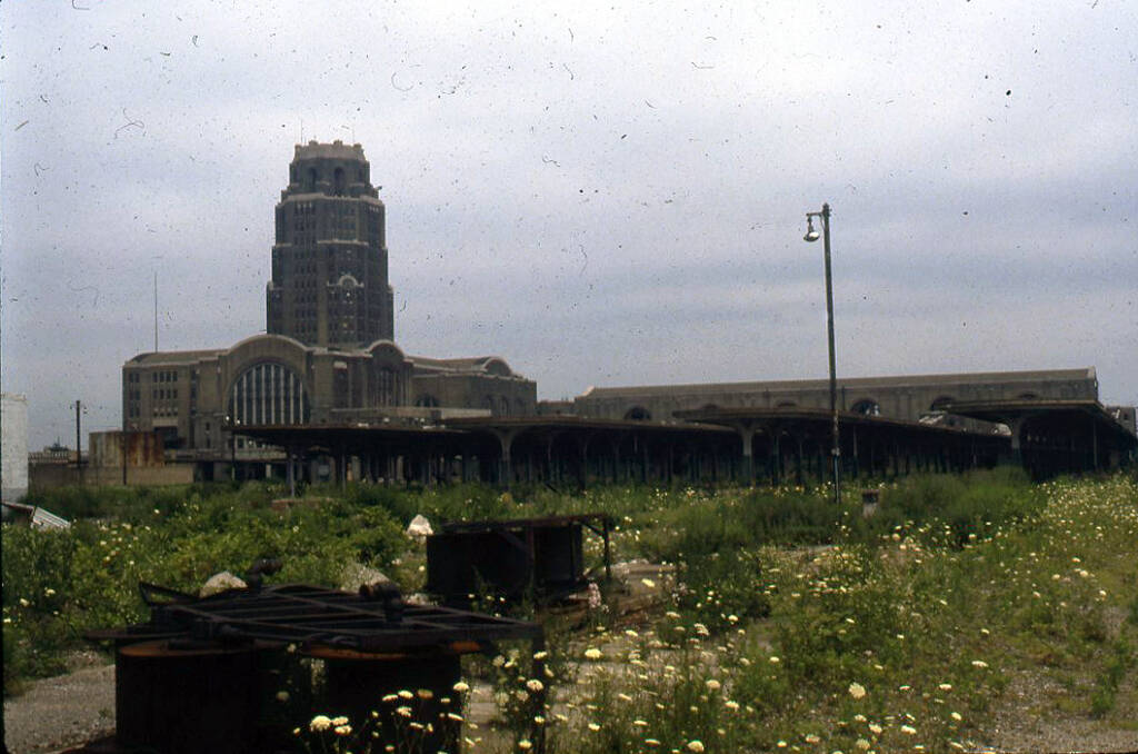 Weeds grow in front of an abandoned station