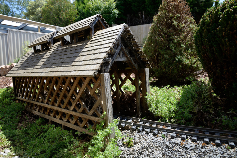 model covered bridge on garden railway