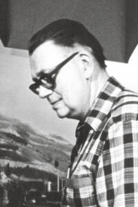 Black-and-white profile of a man in a plaid shirt