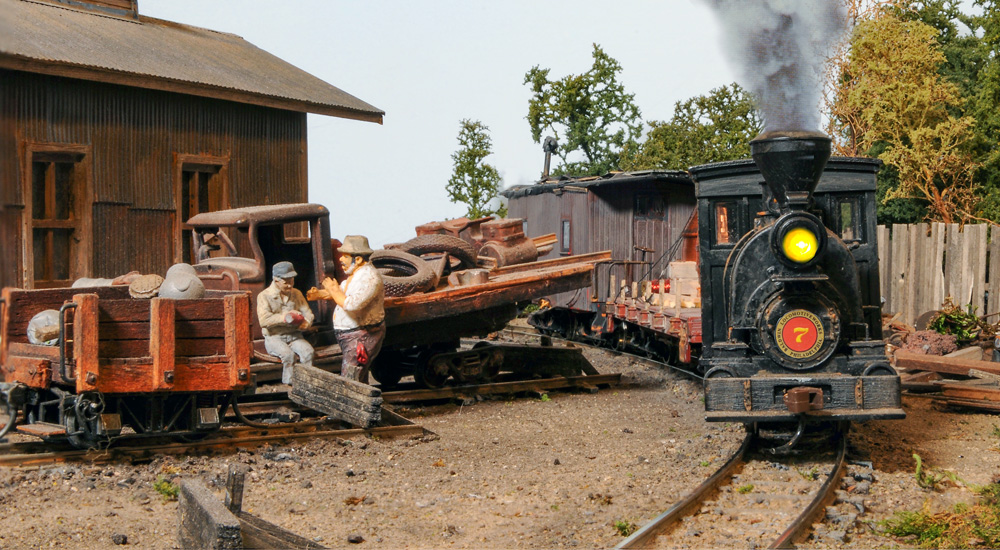 a steam engine pulls a short train around a curve past two workers conversing