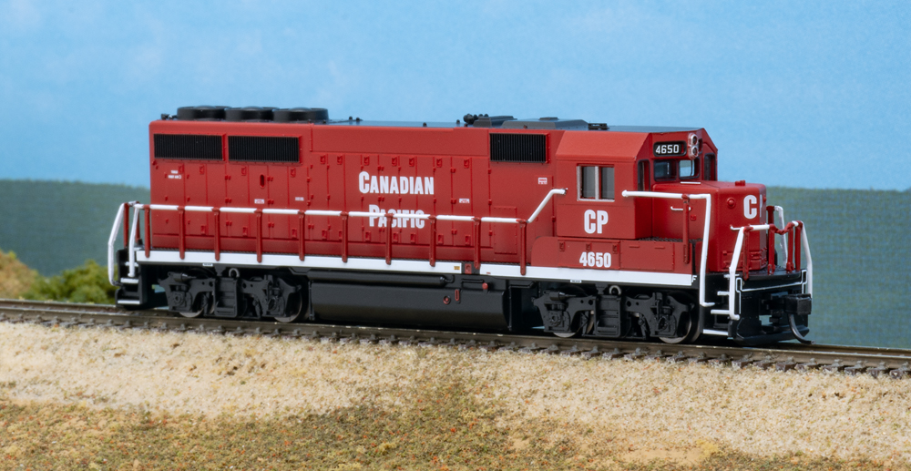 N scale diesel painted red, white, and black on scenic base